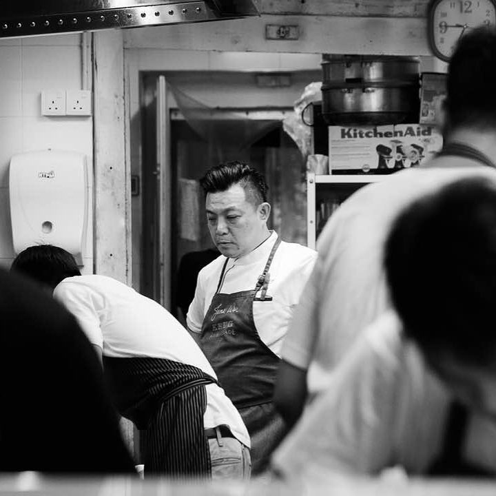 Chef James Won working at Shin Labo counter, black and white